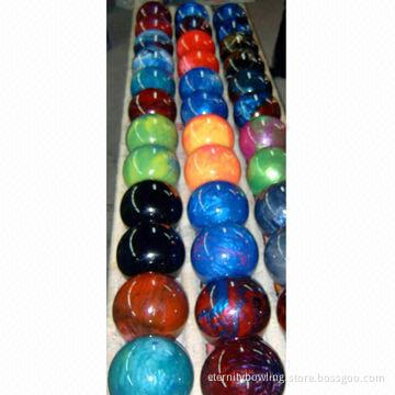 Bowling balls, made of peucine